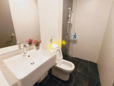 a bathroom with a white sink and a toilet at Rooftop Pool, 8 Pax, 2 Bedrooms, 2 Bathrooms, 2 Car Parks by Star Home in Jelutong