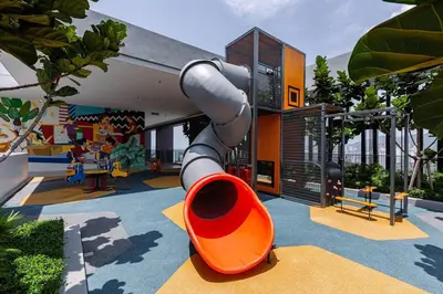 a playground in a house with a slide at Rooftop Pool, 8 Pax, 2 Bedrooms, 2 Bathrooms, 2 Car Parks by Star Home in Jelutong