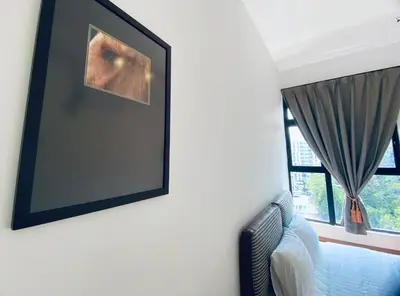 a picture hanging on a wall next to a window at The Cove Hillside@Loft in Ipoh