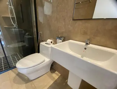 a bathroom with a toilet and a sink and a tub at The Cove Hillside@Loft in Ipoh