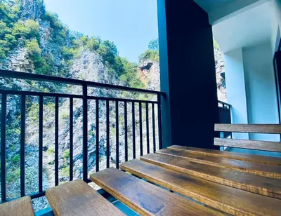 a balcony with stairs and a view of the mountains at The Cove Hillside@Loft in Ipoh