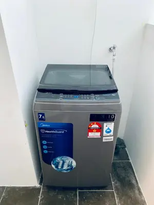 a trash can sitting in the corner of a room at The Cove Hillside@Loft in Ipoh