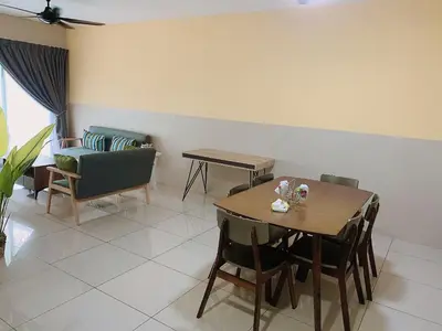 a dining room with a table and chairs at Ipoh Waterpark Pool View Homestay in Ipoh