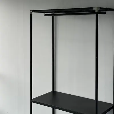 a black shelf against a white wall at Be Right Back Loft - Bukit Mertajam in Bukit Mertajam
