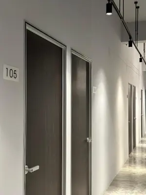 a row of elevator doors in a hallway at Be Right Back Loft - Bukit Mertajam in Bukit Mertajam