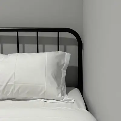 a white pillow sitting on top of a bed at Be Right Back Loft - Bukit Mertajam in Bukit Mertajam