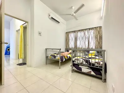 a room with two bunk beds and a window at Casa Ipoh Homestay by Comfort Home in Chemor