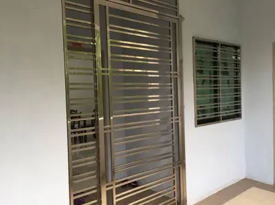 a room with a bunch of metal panels on a wall at 3 Rooms Apartment - Near Beach in Kampong Sungai Udang