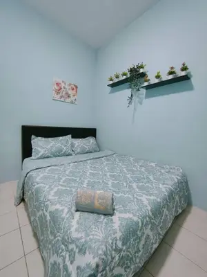 a bedroom with a bed and two shelves on the wall at FZHomestays in Cameron Highlands in Cameron Highlands