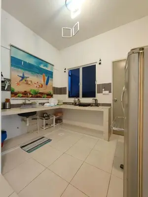 a large kitchen with a sink and a refrigerator at FZHomestays in Cameron Highlands in Cameron Highlands