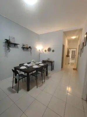 a dining room with a table and chairs in a room at FZHomestays in Cameron Highlands in Cameron Highlands