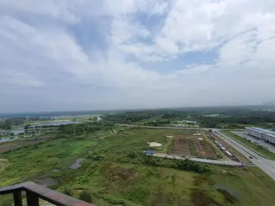 an aerial view of a field and a road at A Modern & Homely Studio with Pool and Gym in Kampar