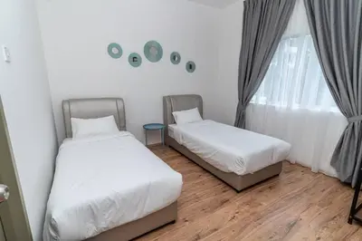 a bedroom with two beds and a window at Sunrise Terrace at Quintet (3BR/8 pax) in Tanah Rata