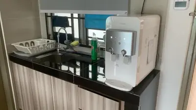 a kitchen counter with a sink and a microwave at City Retreat at Quintet(3BR/8pax) 9 Jalan PMCJ, Tanah Rata in Tanah Rata