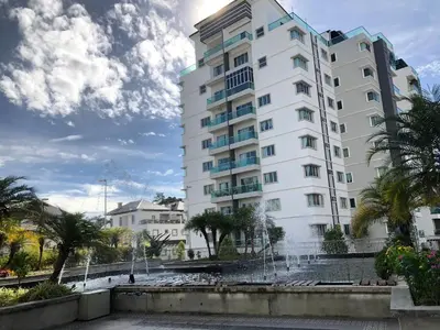 a building with a fountain in front of it at City Retreat at Quintet(3BR/8pax) 9 Jalan PMCJ, Tanah Rata in Tanah Rata