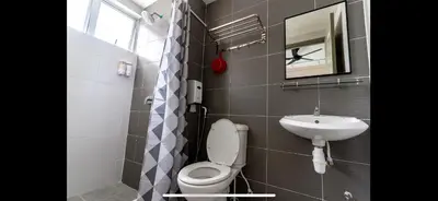 a bathroom with a toilet and a sink at City Retreat at Quintet(3BR/8pax) 9 Jalan PMCJ, Tanah Rata in Tanah Rata