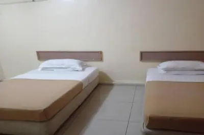 a room with two beds in a room at F Hotel Bayan Lepas in Bayan Lepas