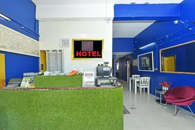 a hotel room with a hotel sign on the wall at F Hotel Bayan Lepas in Bayan Lepas