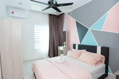a bedroom with a bed and a ceiling fan at Ipoh Town P Kepayang in Ipoh