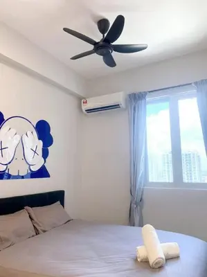 a bedroom with a ceiling fan and a bed at JOVIAL Modern Cozy Suite `Metropol BM BandarPerda in Bukit Mertajam