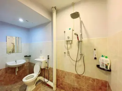 a bathroom with a shower and a toilet and a sink at (TN)Modern Stylish 2 Storey Corner House @Alma BM in Bukit Mertajam
