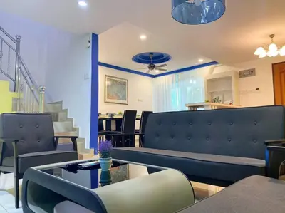 a living room with a couch and a table at (TN)Modern Stylish 2 Storey Corner House @Alma BM in Bukit Mertajam