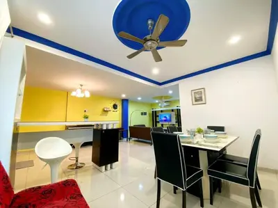 a living room with a ceiling fan and a dining room at (TN)Modern Stylish 2 Storey Corner House @Alma BM in Bukit Mertajam