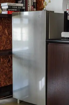 a stainless steel refrigerator in a kitchen at The Octagon Ipoh -- In the Heart of the City in Ipoh