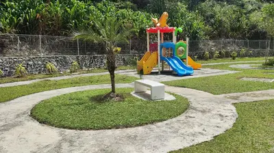 a park with a playground with a tree at A ONE Holiday Apartment-Quintet in Cameron Highlands