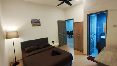 a bedroom with a bed and a bathroom at A ONE Holiday Apartment-Quintet in Cameron Highlands