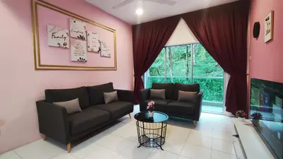 a living room with a couch and a table at A ONE Holiday Apartment-Quintet in Cameron Highlands