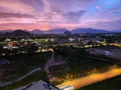 an aerial view of a city at night at Unique Boho Style Condo with NETFLIX for up to 5PAX - Enjoy Mountain View while swimming at the Infinity Pool & Natural Hotspring Pool, 2mins walk to the Lost World of Tambun, Water Themepark at IPOH in Ipoh