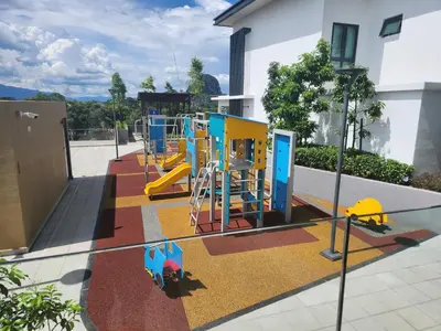 a playground with a slide in a building at Unique Boho Style Condo with NETFLIX for up to 5PAX - Enjoy Mountain View while swimming at the Infinity Pool & Natural Hotspring Pool, 2mins walk to the Lost World of Tambun, Water Themepark at IPOH in Ipoh