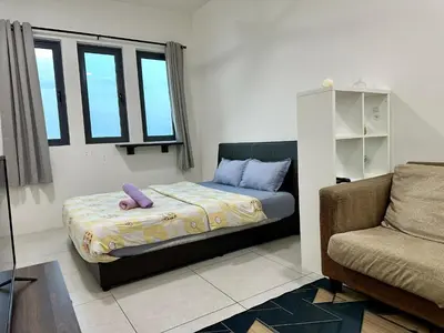a small bedroom with a bed and a couch at Dreamy Cozy Studio Meritus Residensi Perai in Perai