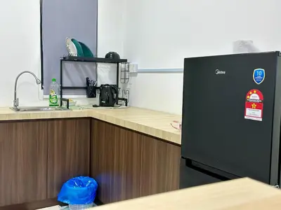 a kitchen with a sink and a refrigerator at Dreamy Cozy Studio Meritus Residensi Perai in Perai