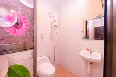 a bathroom with a toilet and a sink at Spring Inn Hotel in Sungai Petani