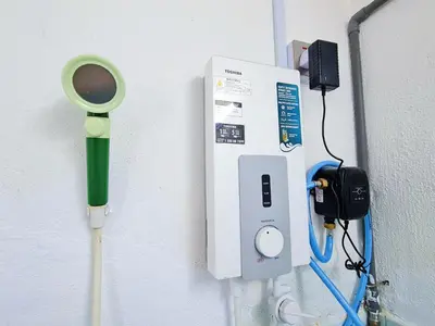 a wall with a thermometer and an outlet with a meter at Cozy n Quiet home near to BKE Highway n Kulim High Tech Park in Lunas