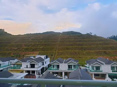 a group of houses in front of a vineyard at WingsNest Cameron Town Night Market High Speed Wi-Fi in Tanah Rata