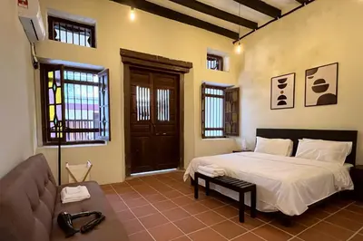 a bedroom with a bed and a couch at Aayu Stewart - Stewart Ln, George Town in George Town
