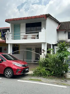 a red car parked in front of a house at AAA Homestay Georgetown Penang in Ayer Itam