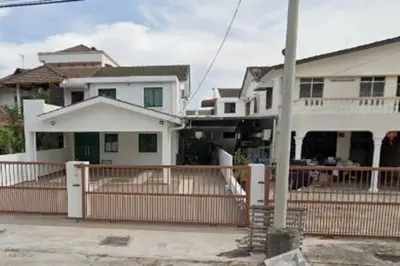 a white house with a fence in front of it at Peace Casa - Homely & Cosy in Butterworth