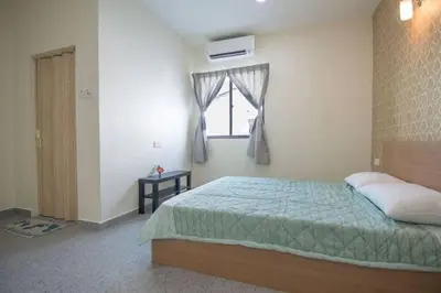 a bedroom with a bed and a window at Peace Casa - Homely & Cosy in Butterworth