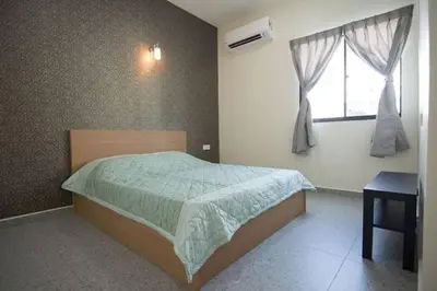 a bedroom with a bed and a window at Peace Casa - Homely & Cosy in Butterworth
