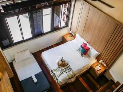 an overhead view of a small bedroom with a bed at Carnarvon Antique Loft in George Town