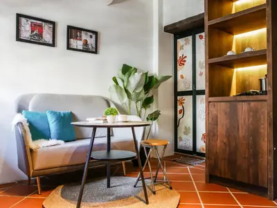 a living room with a table and a couch at Carnarvon Antique Loft in George Town
