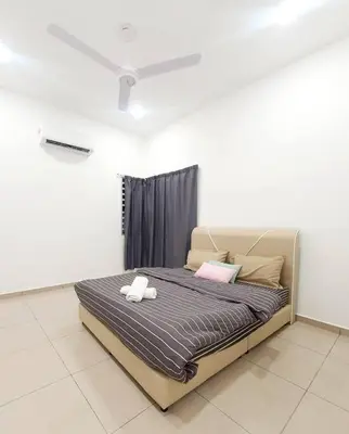 a bedroom with a bed with two stuffed animals on it at JOVIAL COZY&STYLISH 2STORYHOUSE 4ROOM@BMJURU in Bukit Mertajam