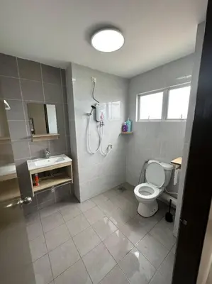 a bathroom with a shower and a toilet and a sink at Ulike Homestay-3Room-4 king Size Bed-The Venus in Sitiawan