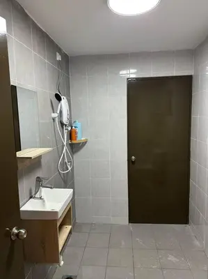 a bathroom with a sink and a black door at Ulike Homestay-3Room-4 king Size Bed-The Venus in Sitiawan
