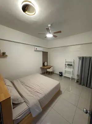 a bedroom with a bed and a ceiling fan at Ulike Homestay-3Room-4 king Size Bed-The Venus in Sitiawan