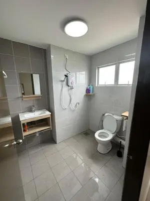 a bathroom with a shower and a toilet and a sink at Ulike Homestay-3Room-4 king Size Bed-The Venus in Sitiawan